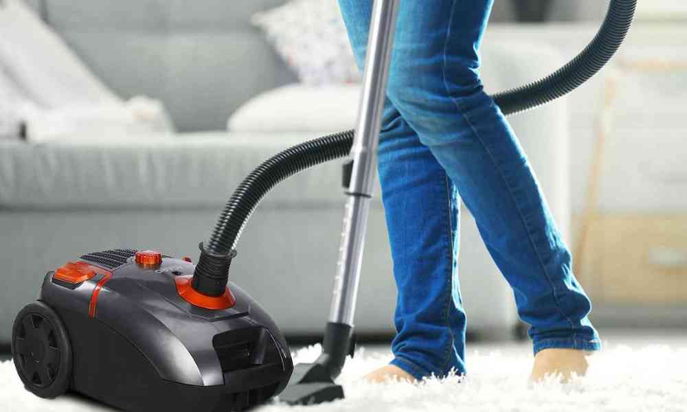 Women cleaning with a vacuum cleaner