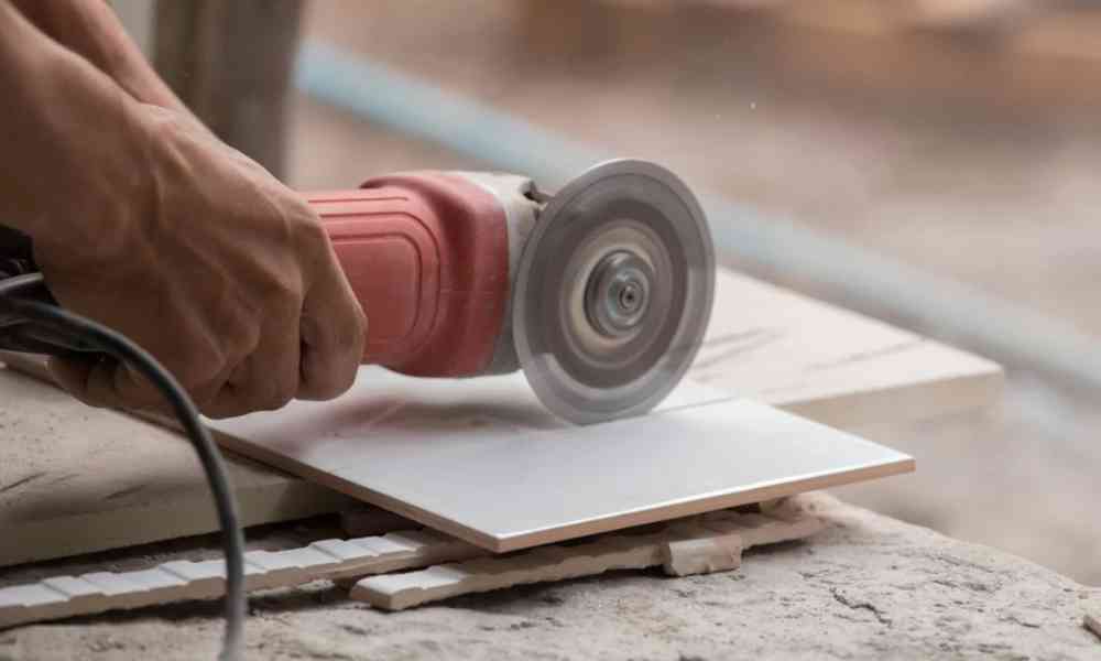 Cut floor tiles to install in compact areas.