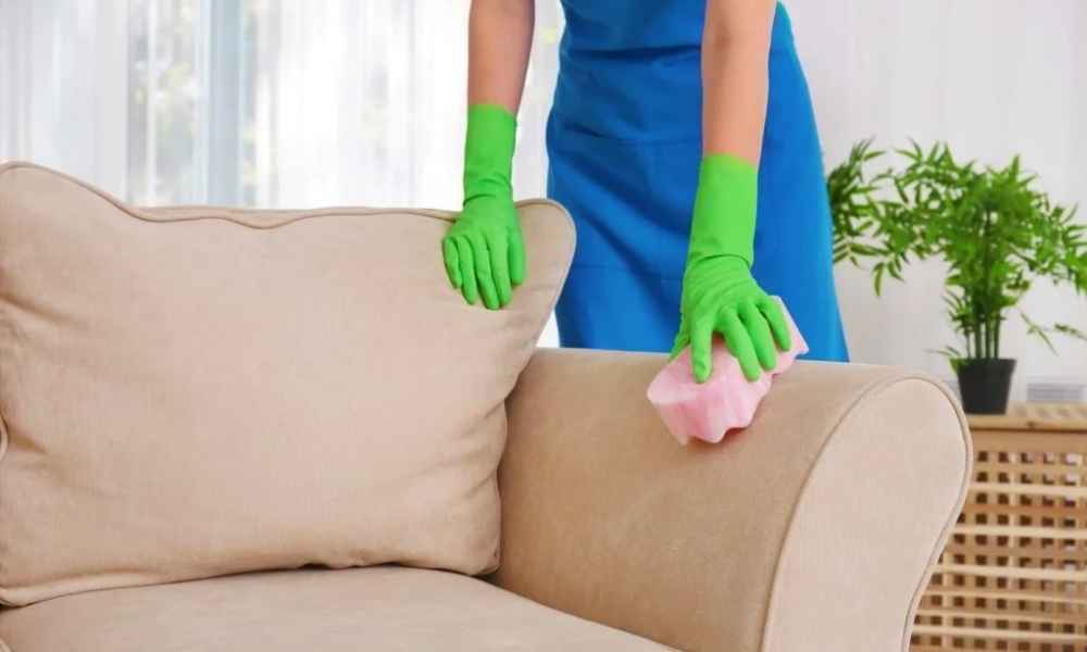 Woman cleaning a couch without a machine