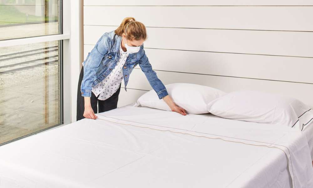 smooth out wrinkles after put flat sheet on bed