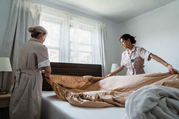 folding a bed sheet cover